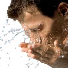 Men washing hes face